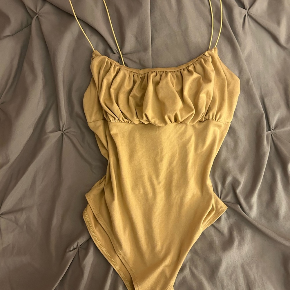 Tan body suit